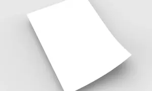 Une feuille blanche, en format demi raisin, est posée sur un fond gris clair, créant une ombre douce.