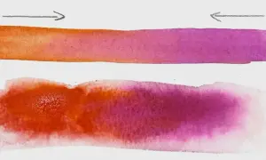 Deux bandes d'aquarelle, une nette et une diffuse, montrent la transition du orange au violet. L'art de peindre une aquarelle.