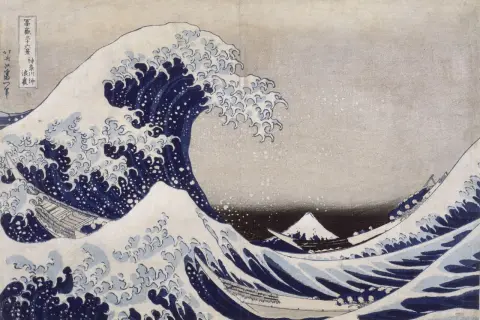 Vague déferlante bleue avec des bateaux et le mont Fuji au loin.