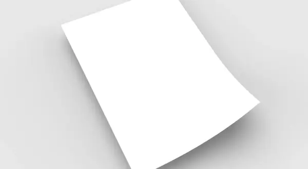 Une feuille blanche, en format demi raisin, est posée sur un fond gris clair, créant une ombre douce.