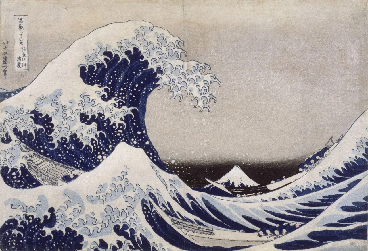 Vague déferlante bleue avec des bateaux et le mont Fuji au loin.