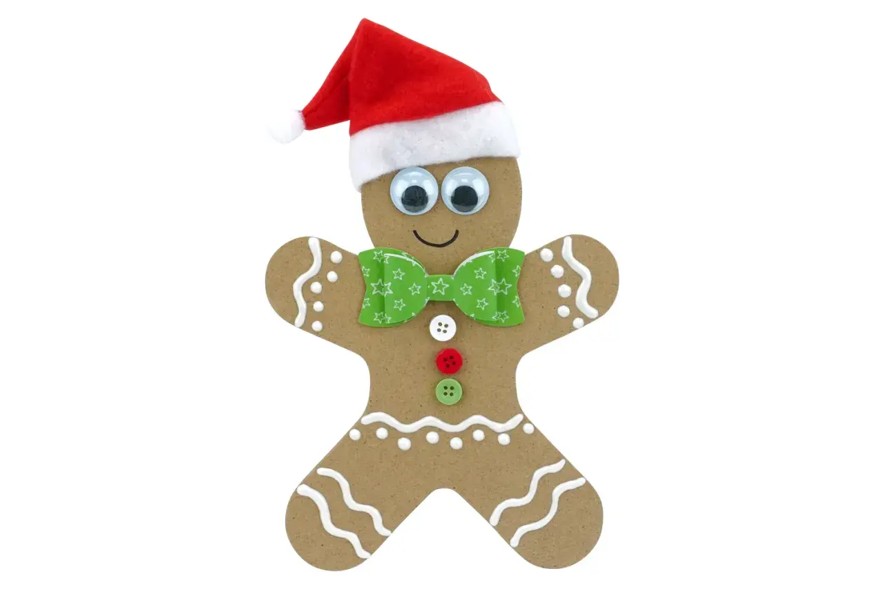 Un joyeux dessin bonhomme pain d'épice, coiffé d'un bonnet de Père Noël, avec des yeux rigolos et un nœud papillon vert.