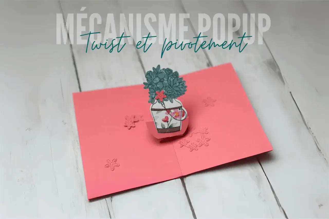 Un dessin pop up de vase fleuri, sur une carte rose. Le m&eacute;canisme twist et pivotement est visible.
