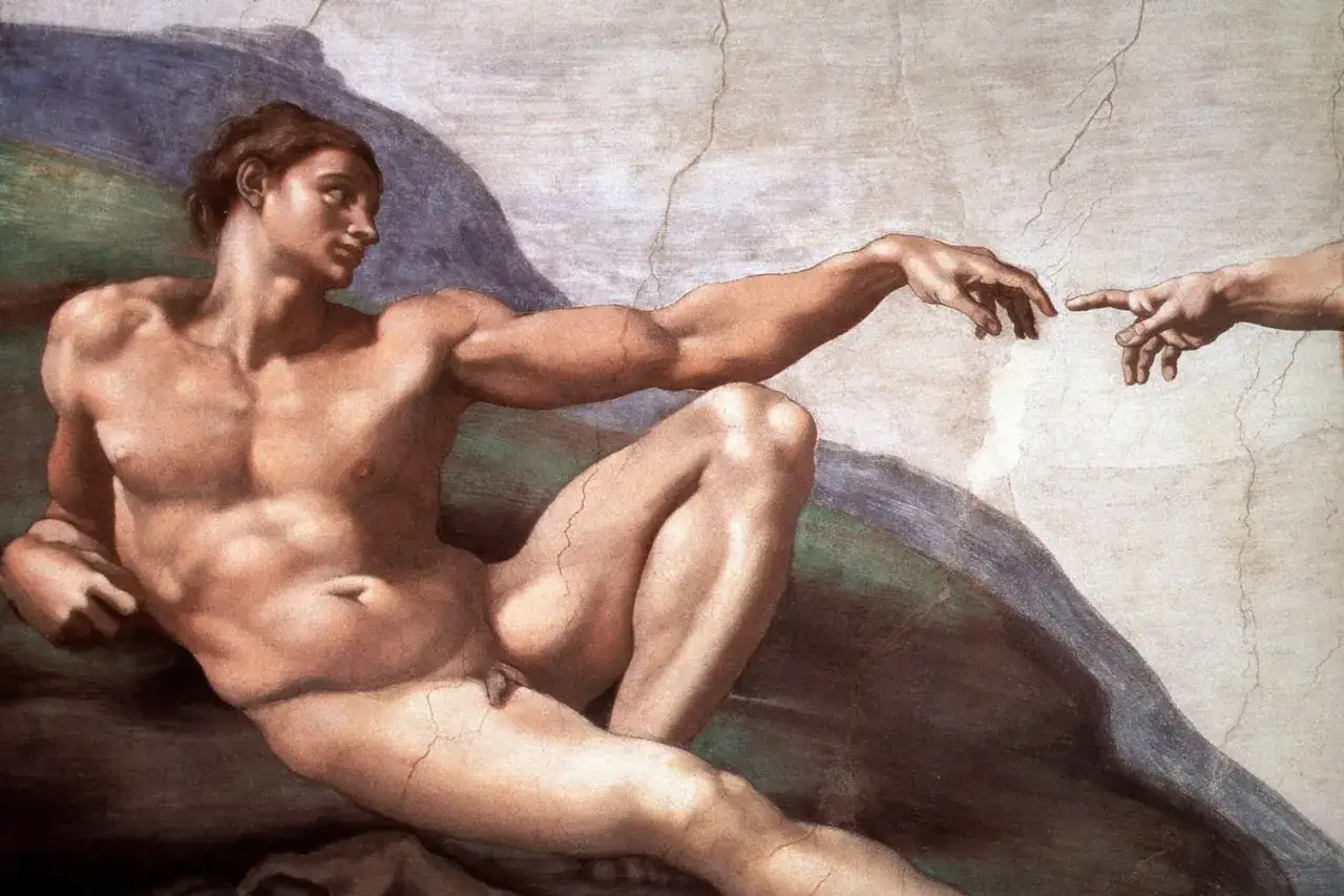 La Création d'Adam par Michel-Ange, un chef-d'œuvre du nu dans l'art, où les doigts divins et humains s'effleurent.