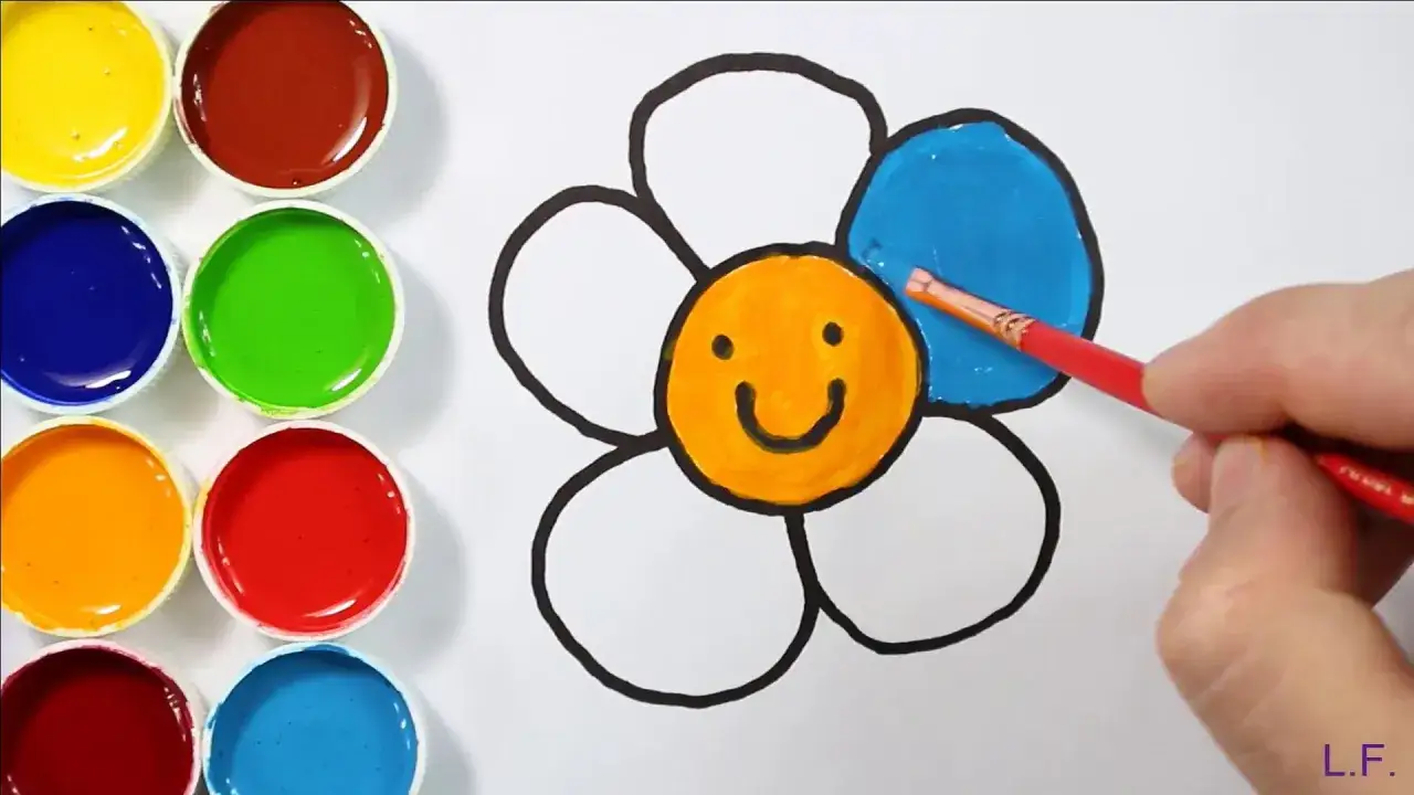 Une jolie fleur dessin facile enfant prend vie avec des couleurs vives. Un pinceau peint une pétale en bleu.